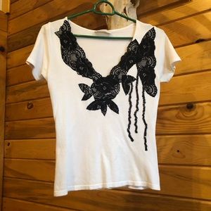 Knitted white top with black lace appliqué